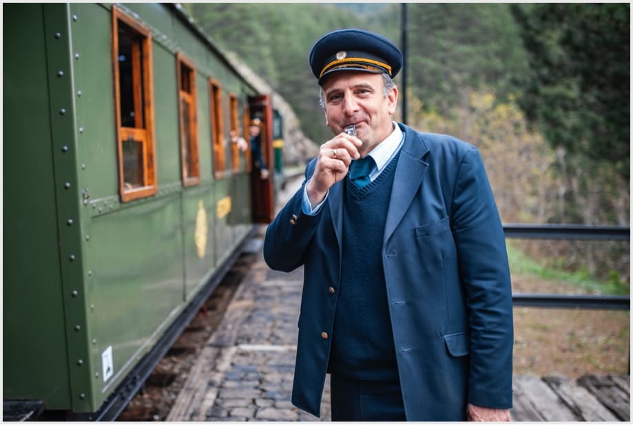 Train conductor blowing whislte