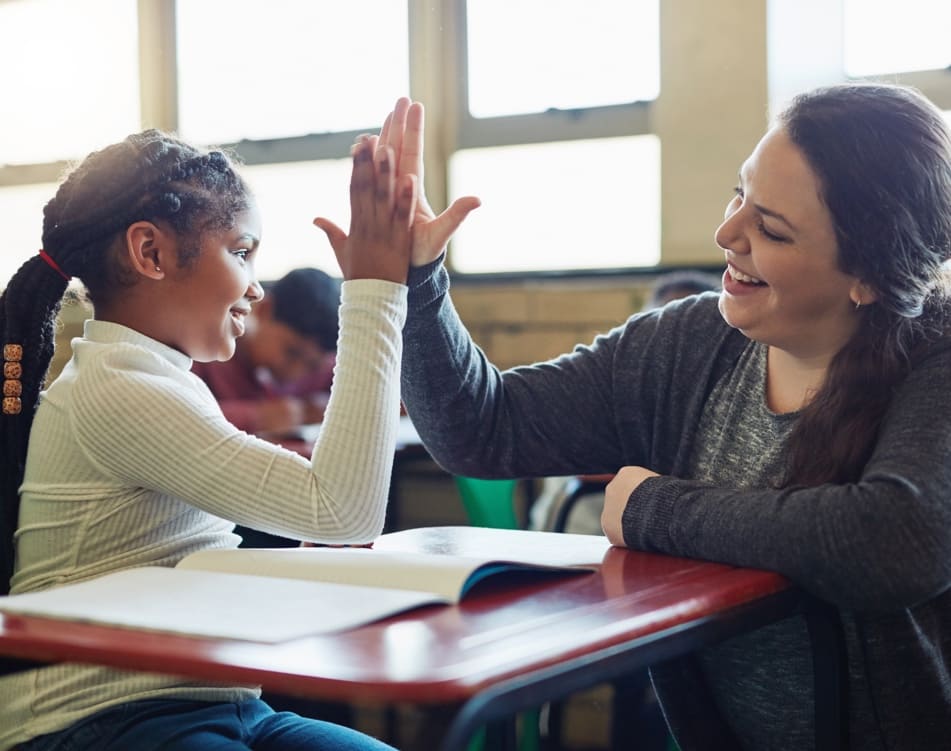 Teacher giving student a high-five